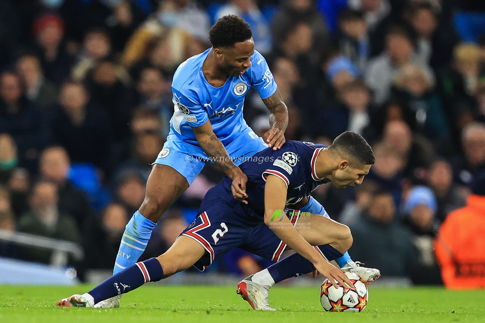 Raheem Sterling #7 of Manchester City and Achraf Hakimi #2 of Paris Saint-Germain battles for the ball