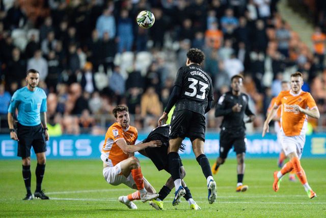 Gabriel Otegbayo of Sheffield Wednesday fouls Jake Beesley of Blackpool during the Carabao Cup match Blackpool vs Sheffield Wednesday at Bloomfield Road, Blackpool, United Kingdom, 17th September 2024

(Photo by Gareth Evans/News Images)