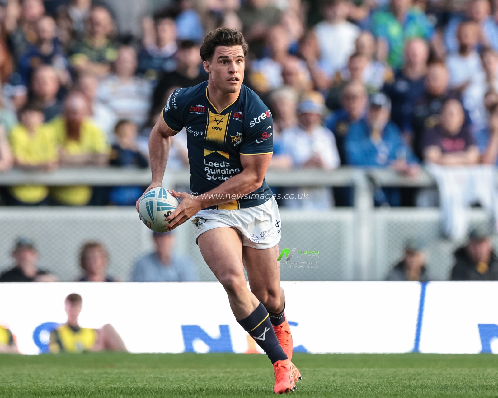 Brodie Croft of Leeds Rhinos breaks with the ball during the Betfred Super League round 12 match Leeds Rhinos vs Huddersfield Giants at AMT Headingley Stadium, Leeds, United Kingdom on 22 May 2026

(Photo by Mark Cosgrove/News Images)