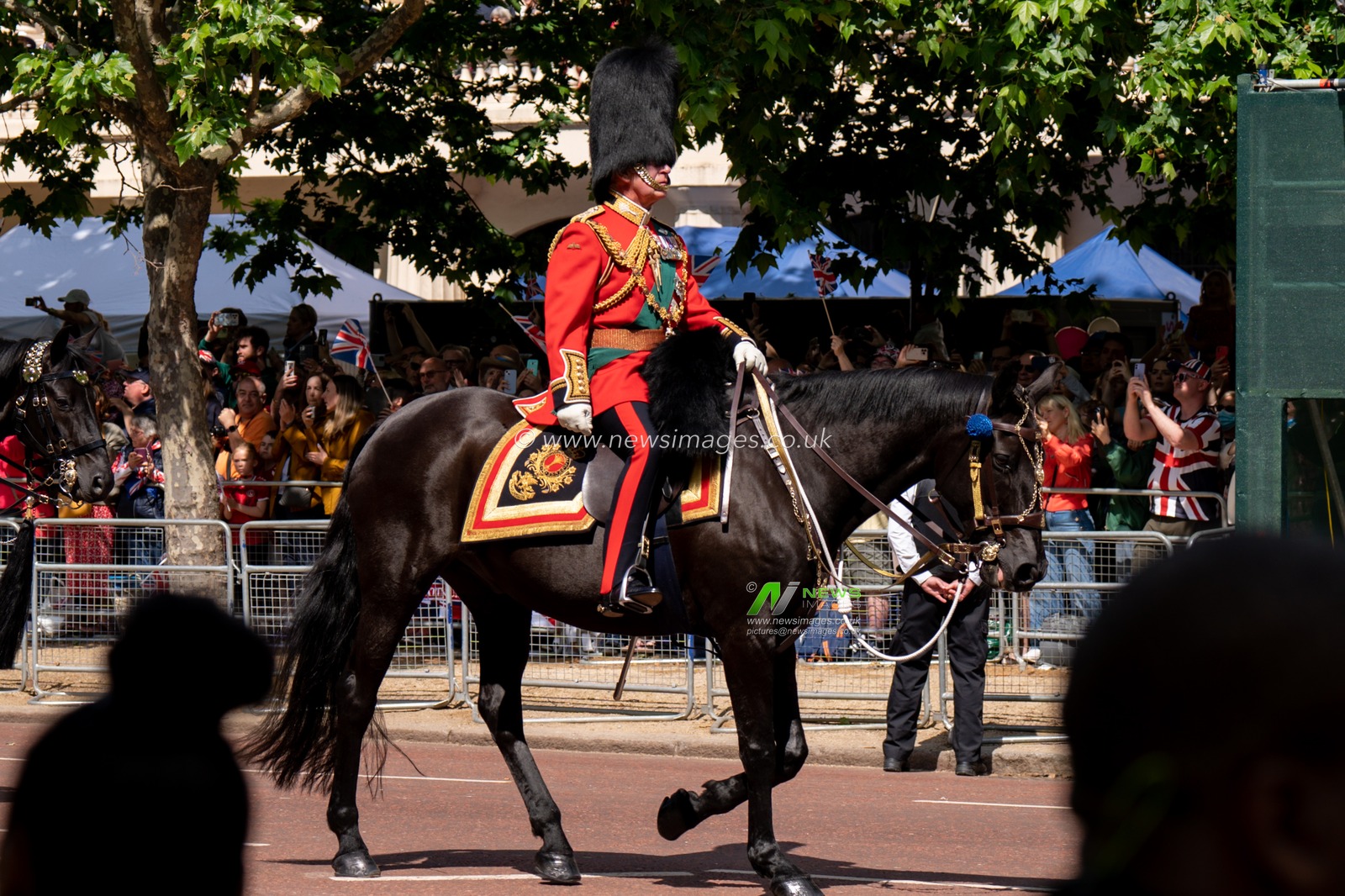 Prince Charles riding down the mall to attend the Trooping the Colour parade