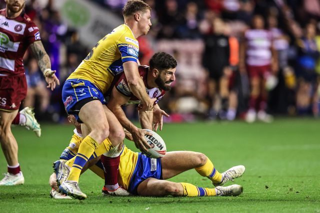 Abbas Miski of Wigan Warriors is tackled by Morgan Gannon of Leeds Rhinos during the Betfred Super League round 27 match Wigan Warriors vs Leeds Rhinos at The Brick Community Stadium, Wigan, United Kingdom, 19th September 2025

(Photo by Alfie Cosgrove/News Images)