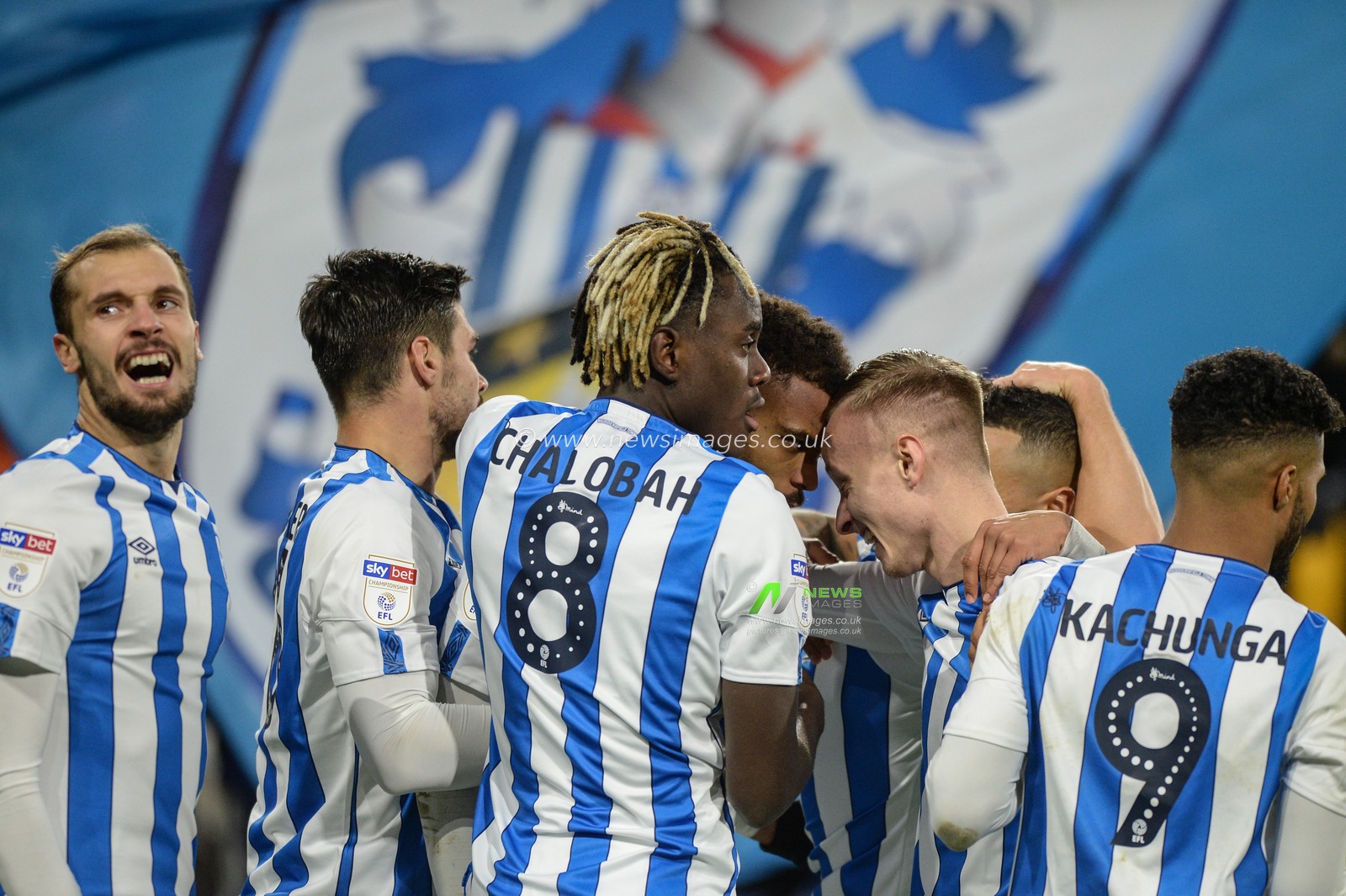 21st December 2019, John Smith's Stadium, Huddersfield, England; Sky Bet Championship, Huddersfield Town v Nottingham Forest : Huddersfield Town players mob goal scorer Steve Mounie, his goal makes it 2-0

Credit: Dean Williams/News Images