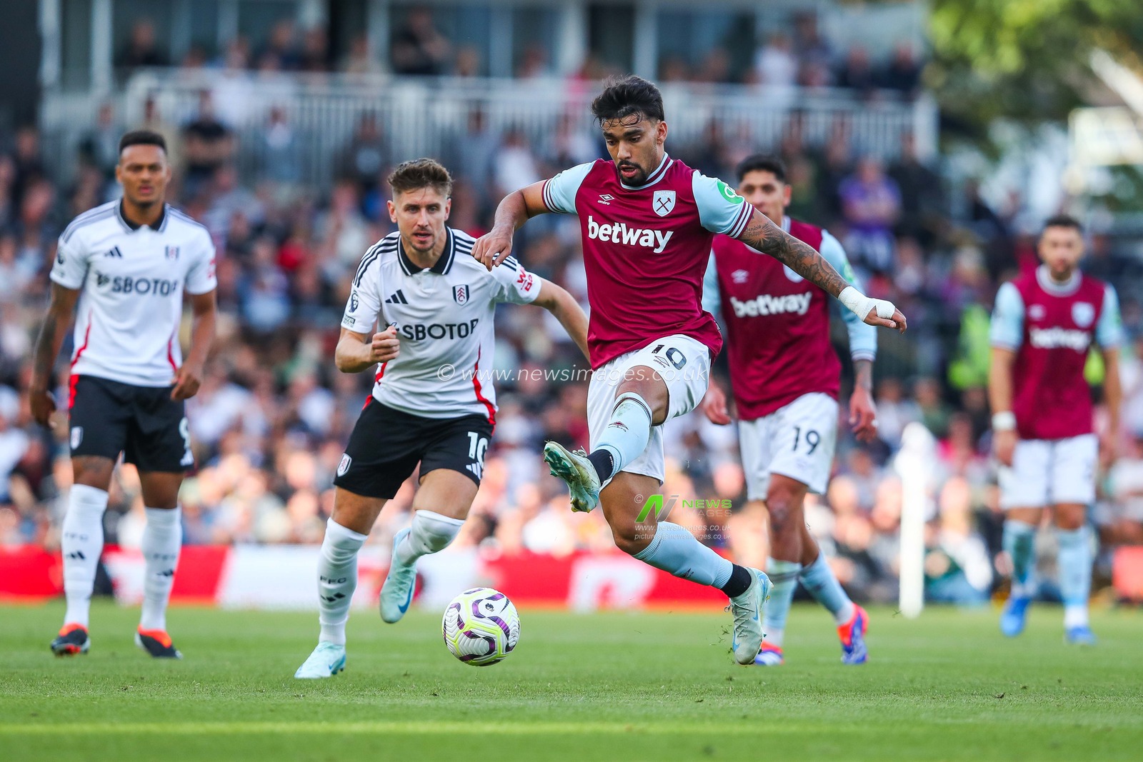 Lucas Paqueta of West Ham United controls the ball during the Premier League match Fulham vs West Ham United at Craven Cottage, London, United Kingdom, 14th September 2024

(Photo by Izzy Poles/News Images)