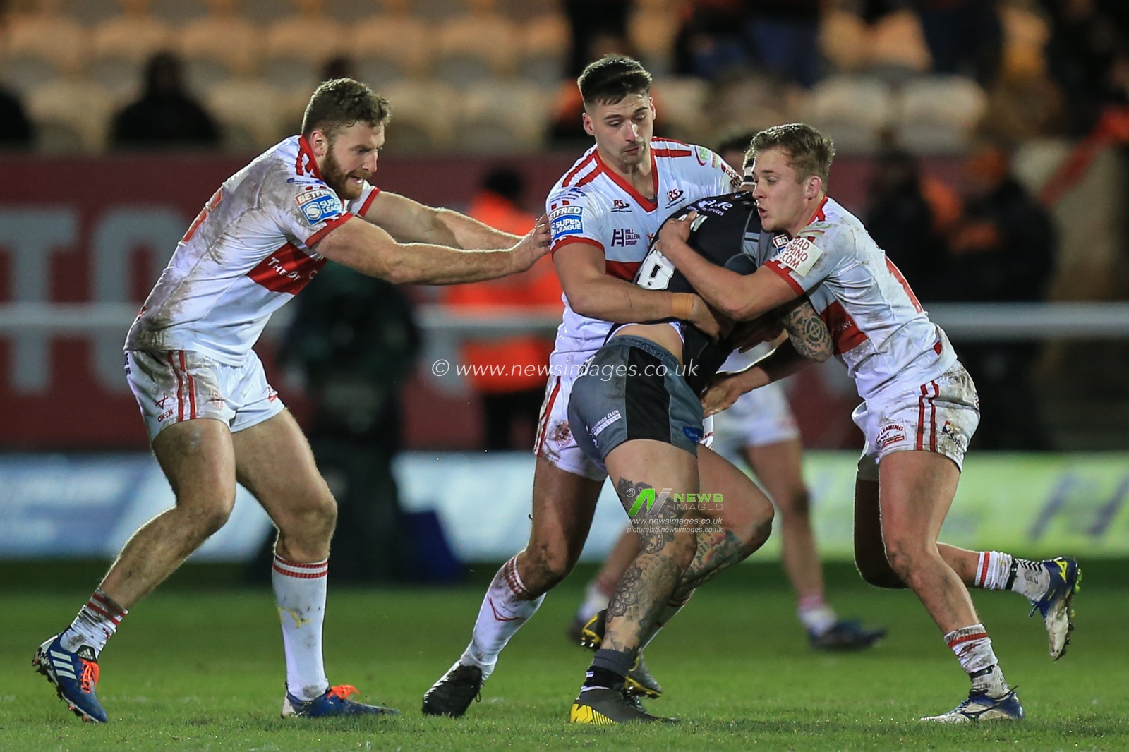 27th February 2020, Hull College Craven Park, Kingston upon Hull, England; Betfred Super League, Hull KR v Castleford Tigers : Owen Harrison (21) and Jez Litten (18) of Hull KR tackle George Griffin (16) of Castleford Tigers