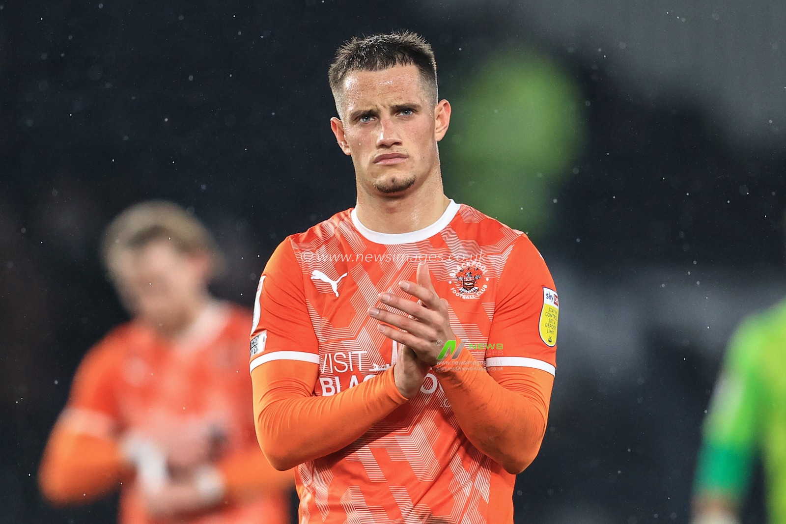 Jerry Yates #9 of Blackpool applauds the traveling fans after losing 1-0