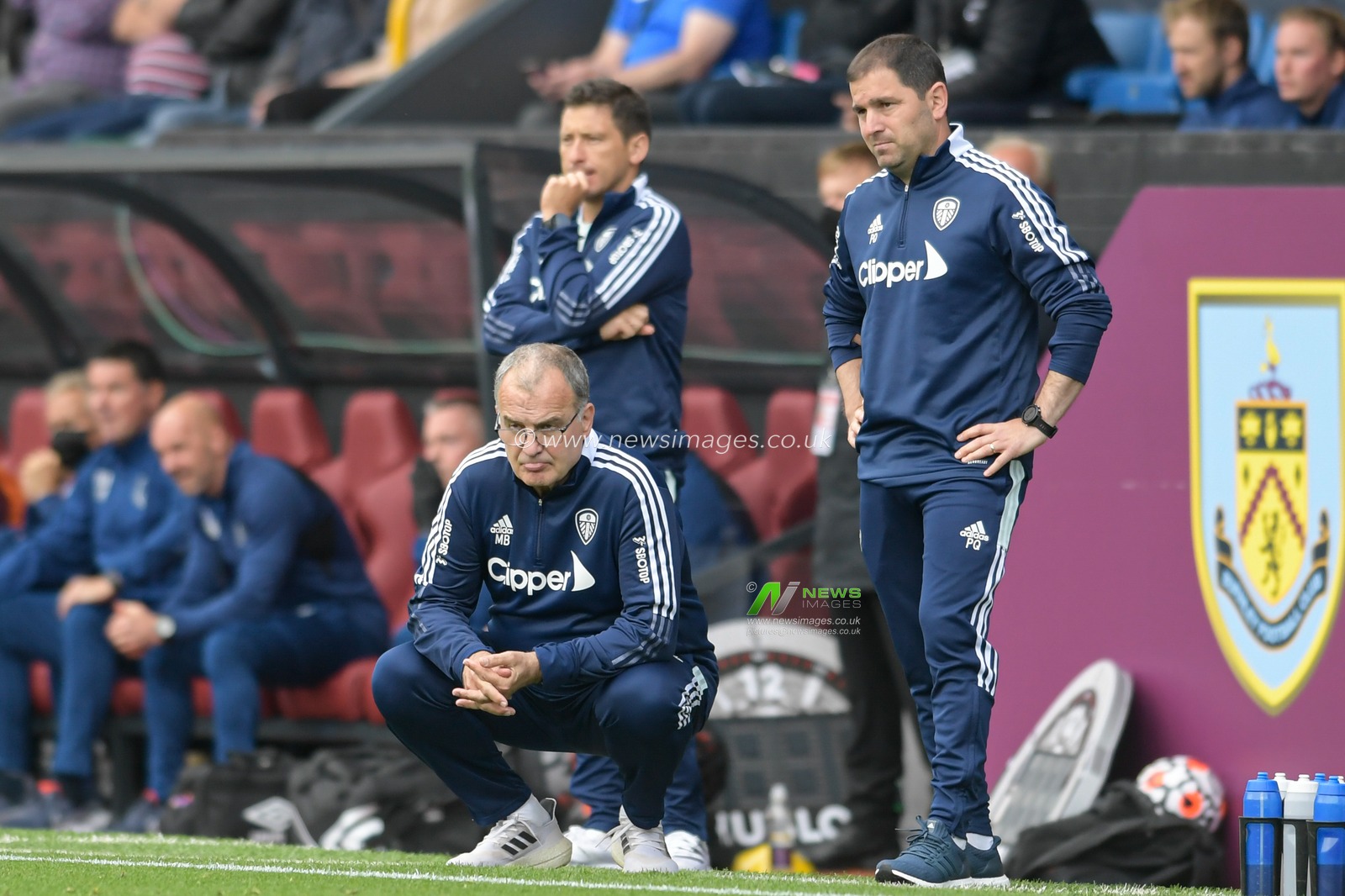 Marcelo Bielsa manager of Leeds United crouches in the technical area
