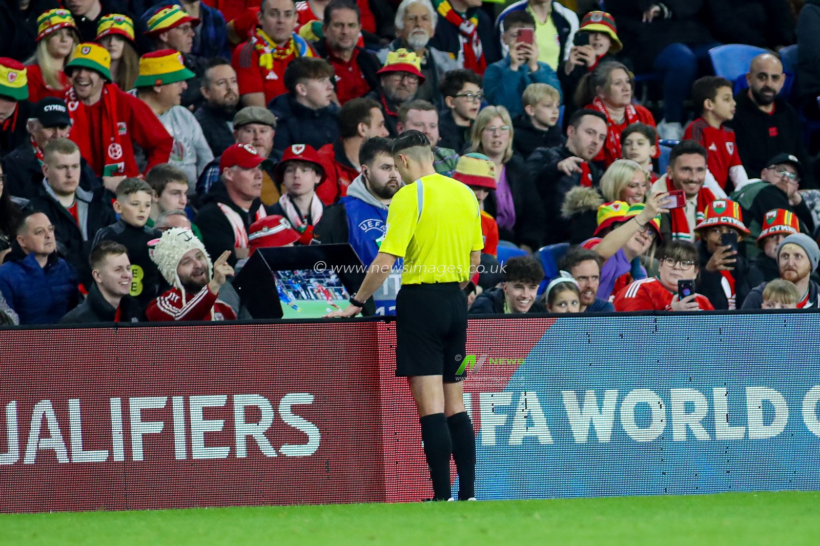 Referee Donatas RumÅ¡as checks VAR during the FIFA World Cup Qualifiers Group J match Wales vs Kazakhstan at Cardiff City Stadium, Cardiff, United Kingdom, 22nd March 2025

(Photo by Andrew Lewis/News Images)