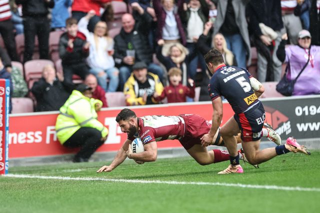 Abbas Miski of Wigan Warriors goes over for a try to make it 22-14 during the Betfred Super League Round 8 match Wigan Warriors vs St Helens at The Brick Community Stadium, Wigan, United Kingdom, 18th April 2025

(Photo by Mark Cosgrove/News Images)