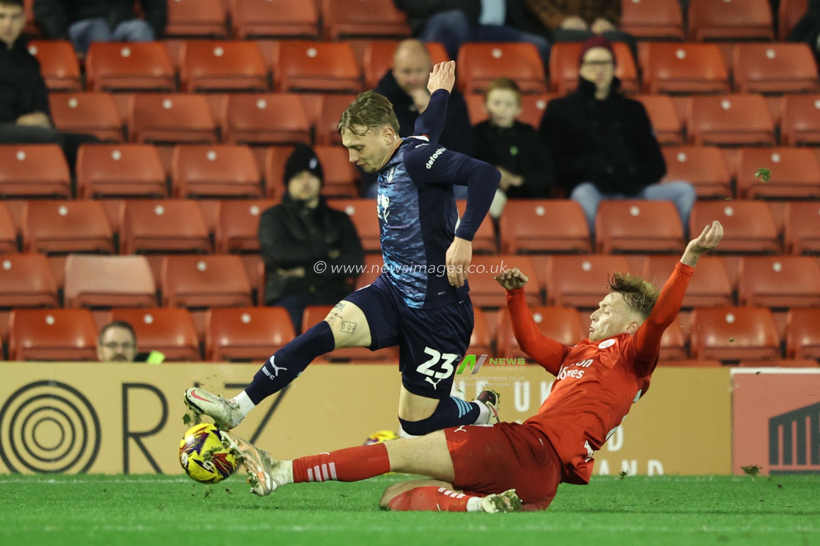 Jack Holmes of Rotherham United is tackled by Georgie Gent of Barnsley during the Sky Bet League 1 match Barnsley vs Rotherham United at Oakwell, Barnsley, United Kingdom, 8th November 2024

(Photo by Alfie Cosgrove/News Images)