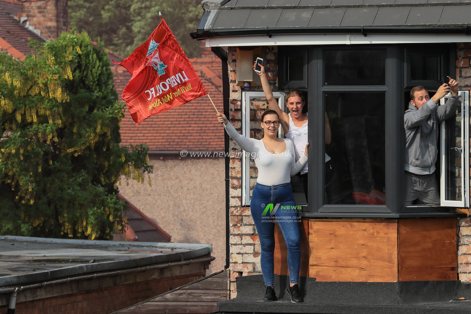 2nd June 2019 , Liverpool, England; UEFA Champions League, Liverpool FC Champions League winners celebrations and open top bus parade ; Liverpool fans line the streets to welcome home their heroes after winning the European Cup for the sixth time 

Credit: Mark Cosgrove/News Images