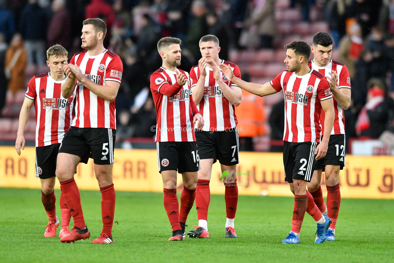 22nd February 2020, Bramall Lane, Sheffield, England; Premier League, Sheffield United v Brighton and Hove Albion : Jack O'Connell (5), Ben Osborn (23), Oliver Norwood (16), John Lundstram (7), John Egan (12) and  George Baldock (2) of Sheffield United congratulate each other and the home supporters at the end of the game