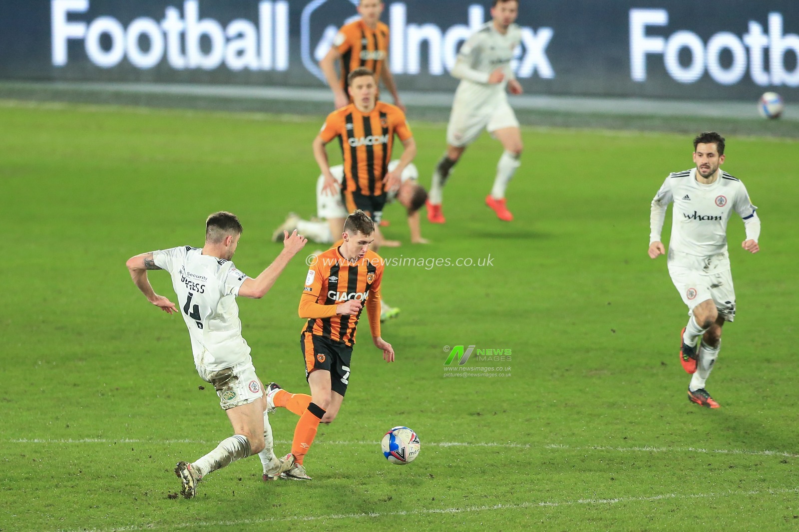 Cameron Burgess #4 of Accrington Stanley fouls Gavin Whyte #23 of Hull City