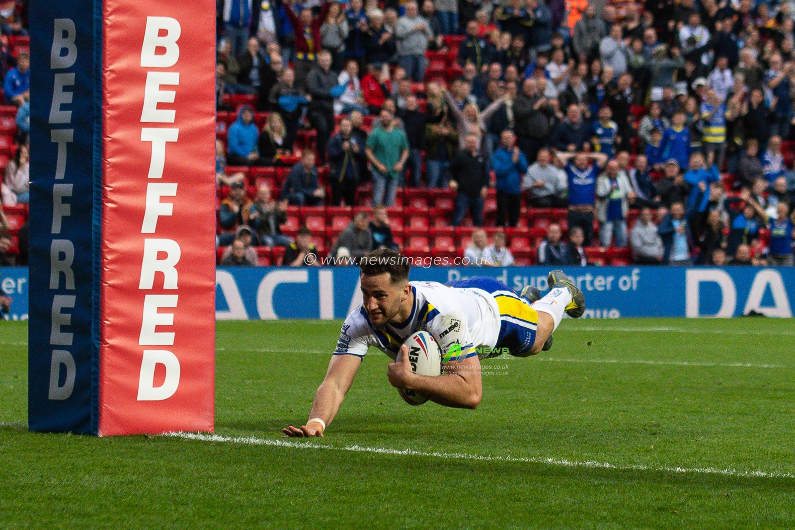 25th May 2019 , Anfield Stadium, Liverpool, England; Dacia Magic Weekend, Betfred Super League Round 16, Wigan Warriors vs Warrington Wolves ; Toby King (18) of Warrington Wolves scores a try

Credit: Craig Thomas/News Images