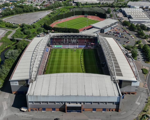 An aerial view of The Brick Community Stadium and Robin Park during the Betfred Super League Round 11 match Wigan Warriors vs Leigh Leopards at The Brick Community Stadium, Wigan, United Kingdom, 16th May 2025

(Photo by Mark Cosgrove/News Images)