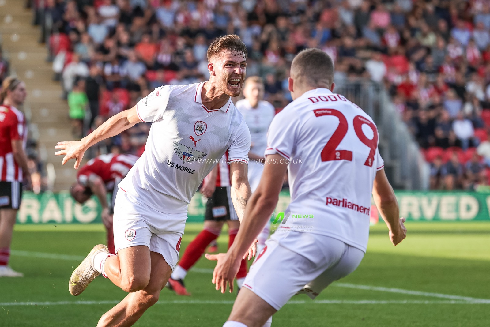 John Mcatee #45 of Barnsley celebrates his goal to make it 0-1 during the Sky Bet League 1 match Exeter City vs Barnsley at St James' Park, Exeter, United Kingdom, 7th October 2023

(Photo by Mark Cosgrove/News Images)
