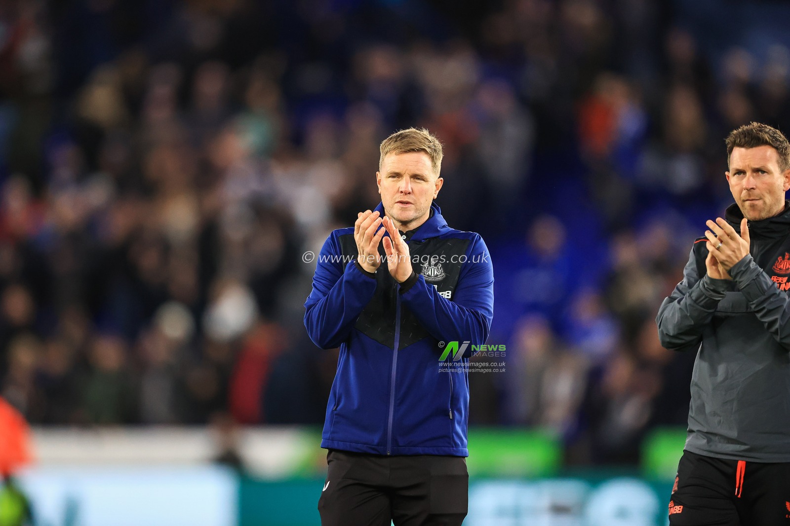 Eddie Howe manager of Newcastle United applauds the travelling fans at the end of the game
