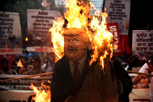 Activists from the Socialist Unity Centre of India (SUCI) burned an effigy of U.S. President Donald Trump and Israeli Prime Minister Benjamin Netanyahu during an anti-Israel protest to express solidarity with Palestinians, in Kolkata on October 7, 2025.Photo by Debajyoti Chakraborty.(Photo: Debajyoti Chakraborty/News Images)