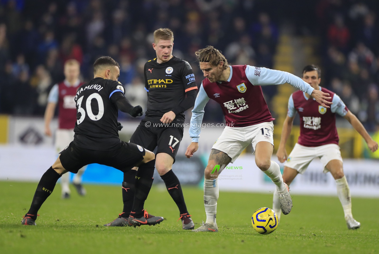3rd December 2019, Turf Moor, Burnley, England; Premier League, Burnley v Manchester City : Jeff Hendrick (13) of Burnley is challenged by Nicolas Otamendi (30) of Manchester City  

Credit: Conor Molloy/News Images