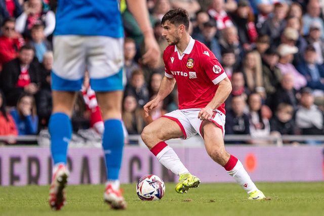 Wrexham's Ryan Longman carries the ball during the Sky Bet League 1 match Wrexham vs Stockport County at SToK Cae Ras, Wrexham, United Kingdom, 22nd March 2025

(Photo by Nik Mesney/News Images)