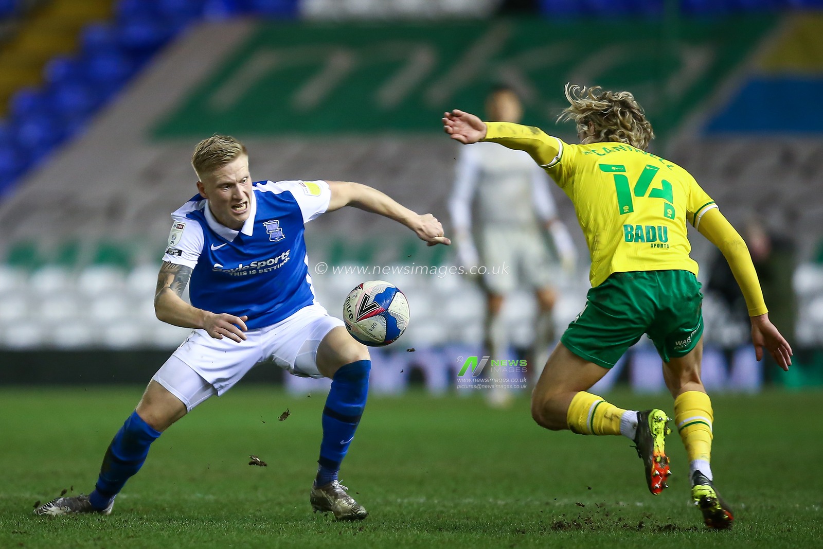 Kristian Pedersen #3 of Birmingham City  and Todd Cantwell #14 of Norwich City compete for the ball