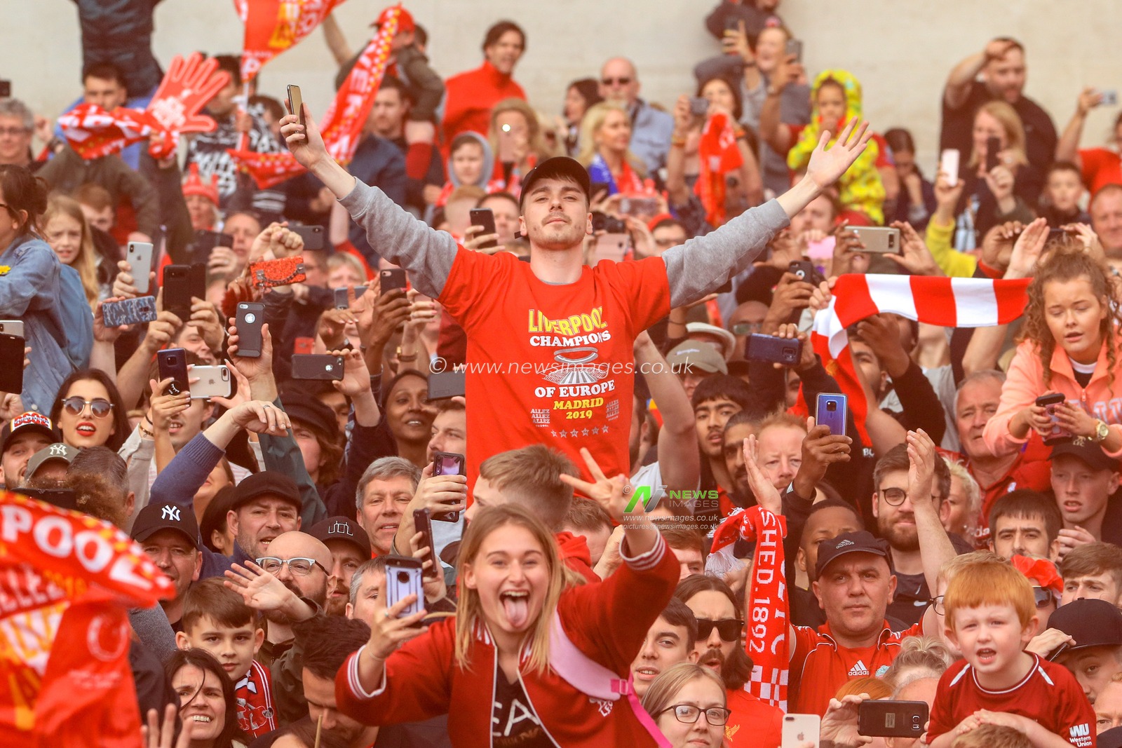 2nd June 2019 , Liverpool, England; UEFA Champions League, Liverpool FC Champions League winners celebrations and open top bus parade ; Liverpool fans line the streets to welcome home their heroes after winning the European Cup for the sixth time 

Credit: Mark Cosgrove/News Images