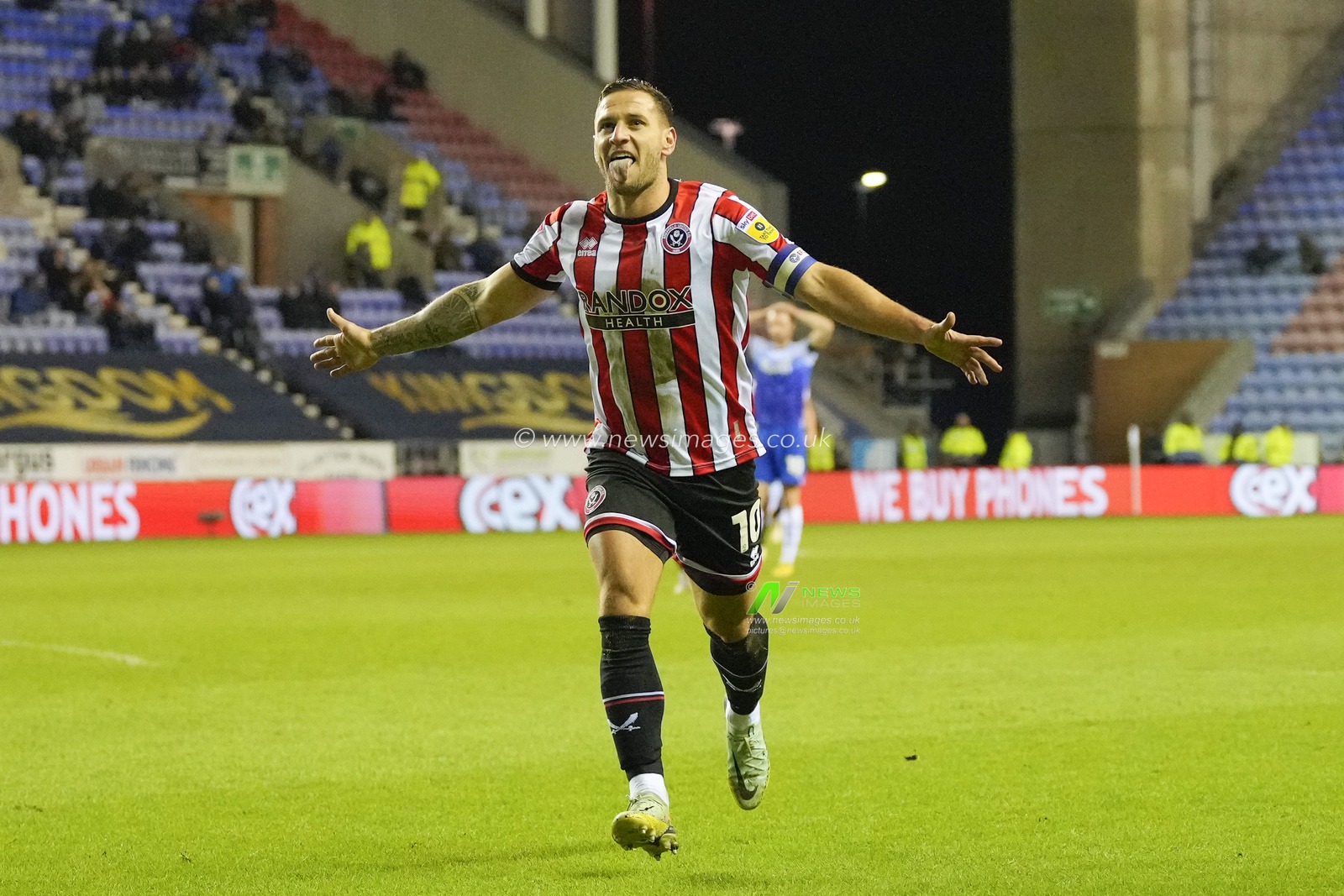 Billy Sharp #10 of Sheffield United runs to the fans to celebrate scoring to make it 0-2 during the Sky Bet Championship match Wigan Athletic vs Sheffield United at DW Stadium, Wigan, United Kingdom, 19th December 2022

(Photo by Steve Flynn/News Images)