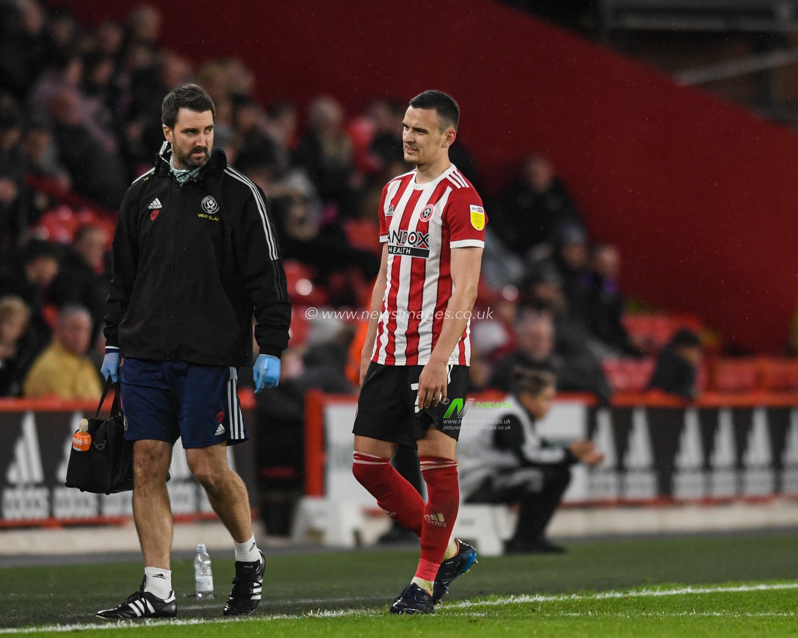 Filip Uremovic #25 of Sheffield United leaves the pitch after an injury