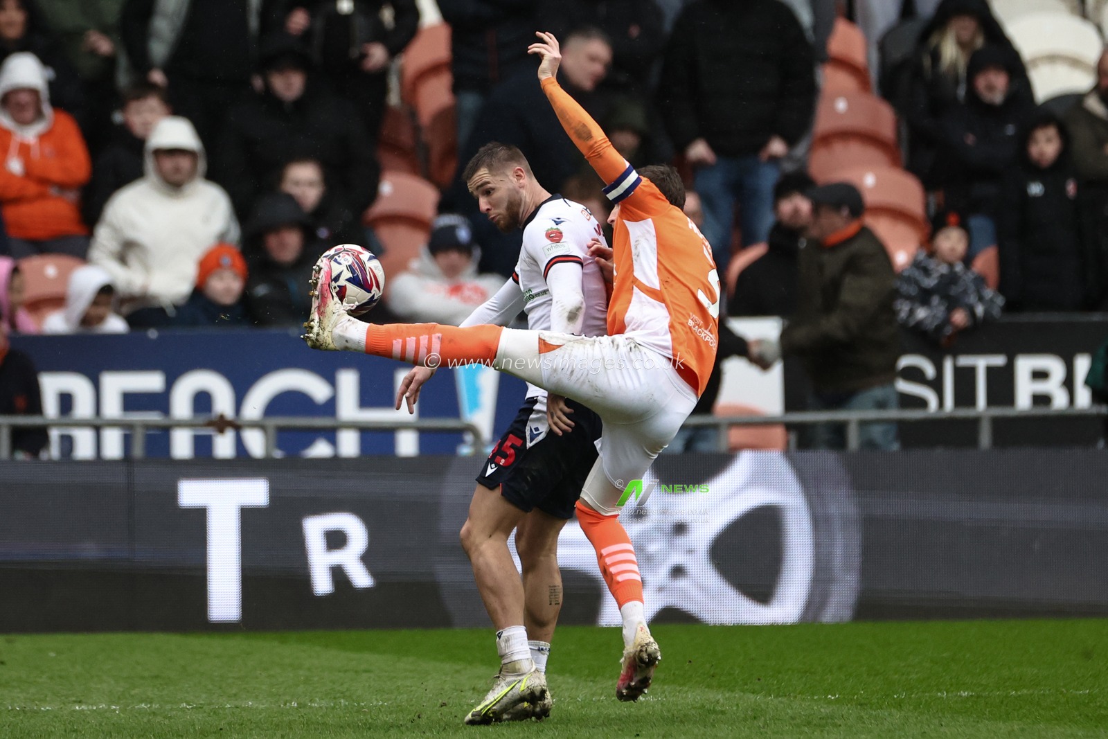 John McAtee of Bolton Wanderers is fouled by James Husband of Blackpool during the Sky Bet League 1 match Blackpool vs Bolton Wanderers at Bloomfield Road, Blackpool, United Kingdom, 29th March 2025

(Photo by Mark Cosgrove/News Images)