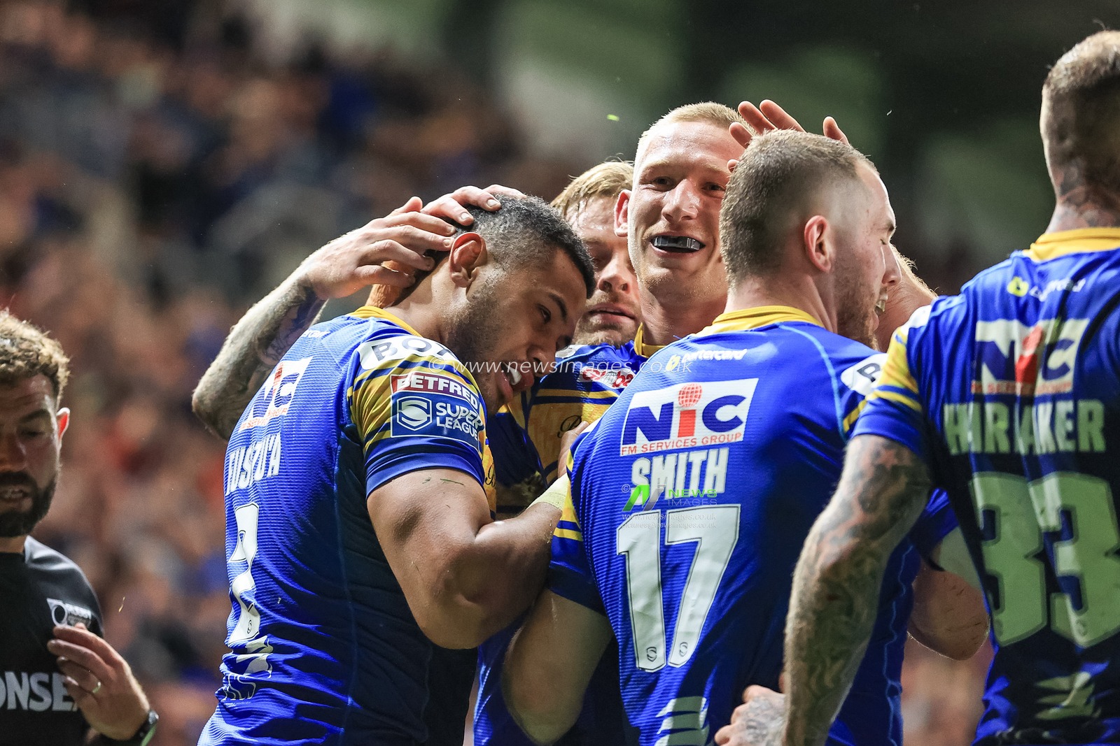 Fusitu'a of Leeds Rhinos celebrates his try with team mates