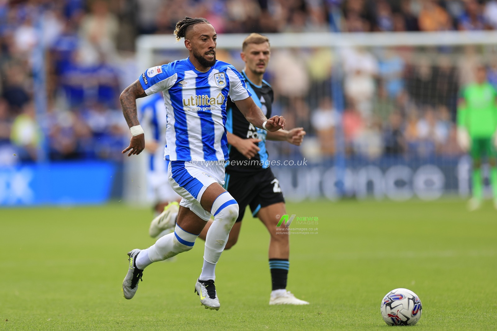 Sorba Thomas #14 of Huddersfield Town runs into attack during the Sky Bet Championship match Huddersfield Town vs Leicester City at John Smith's Stadium, Huddersfield, United Kingdom, 12th August 2023

(Photo by Conor Molloy/News Images)