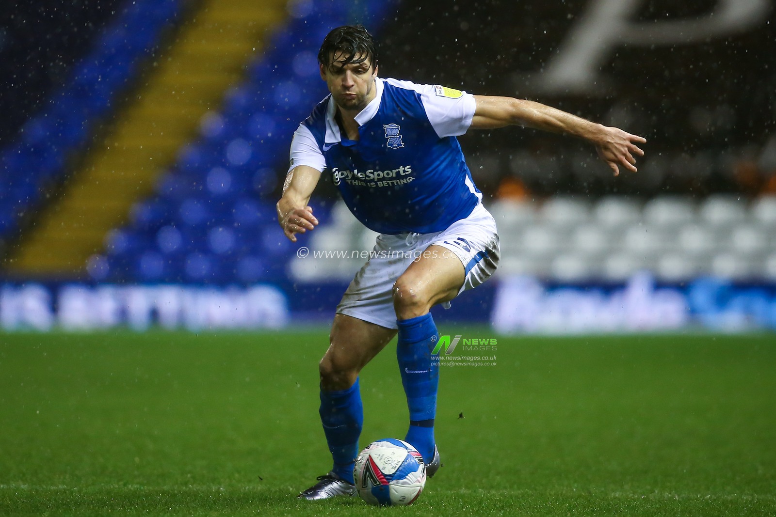 George Friend #5 of Birmingham City dribbles the ball