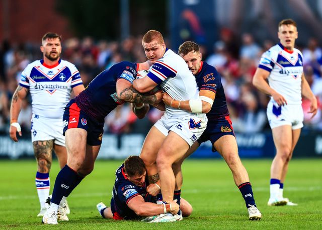 Caius Faatili of Wakefield Trinity is tackled during the Betfred Super League round 21 match Wakefield Trinity vs St Helens at DIY Kitchens Stadium, Wakefield, United Kingdom, 8th August 2025

(Photo by Richard Bierton/News Images)
