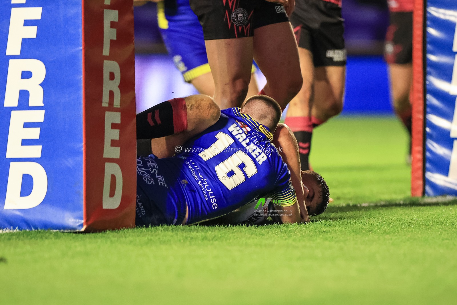 Danny Walker #16 of Warrington Wolves goes over for a try