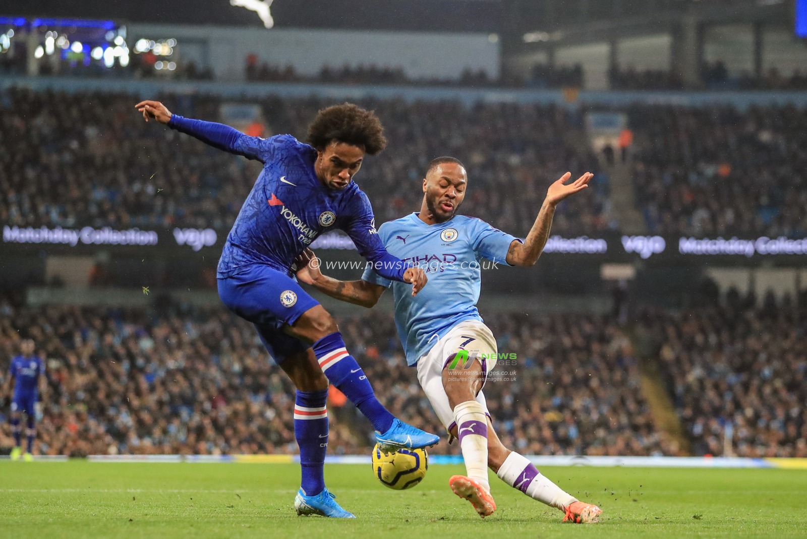23rd November 2019, Etihad Stadium, Manchester, England; Premier League, Manchester City v Chelsea : Willian (10) of Chelsea and Raheem Sterling (7) of Manchester City dual for the ball 

Credit: Mark Cosgrove/News Images
