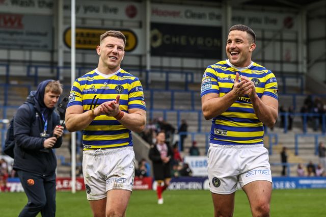 George Williams of Warrington Wolves and Josh Smith of Warrington Wolves applauds the fans after the game during the Betfred Super League round 7 match Warrington Wolves vs Leigh Leopards at The Halliwell Jones Stadium, Warrington, United Kingdom on 04 April 2026

(Photo by Alfie Cosgrove/News Images)