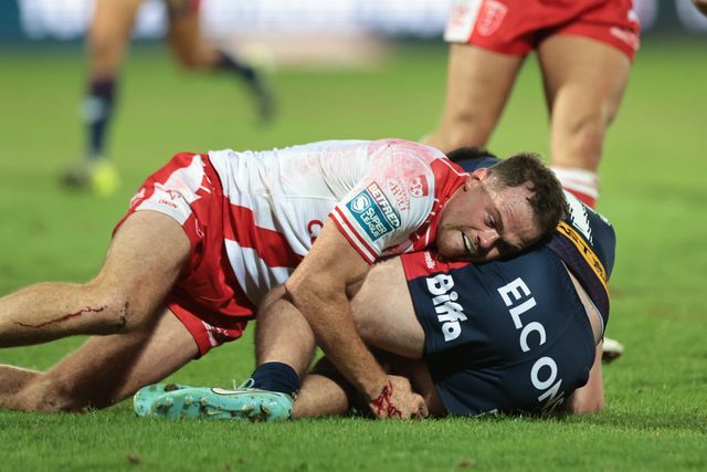Jack Welsby of St. Helens is tackled by Joe Burgess of Hull KR during the Betfred Super League Round 24 match Hull KR vs St Helens at Sewell Group Craven Park, Kingston upon Hull, United Kingdom, 29th August 2025

(Photo by Mark Cosgrove/News Images)
