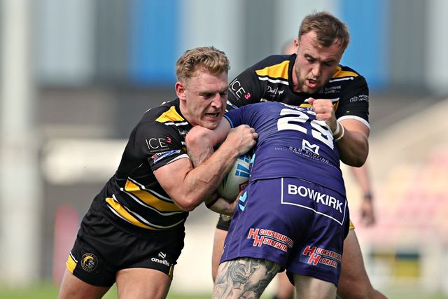 Connor Bailey of York Knights RLFC and Liam Harris of York Knights RLFC tackle James Glover of Featherstone Rovers during the Betfred Championship match York City Knights vs Featherstone Rovers at LNER Community Stadium, York, United Kingdom, 29th June 2025

(Photo by Sam Eaden/News Images)