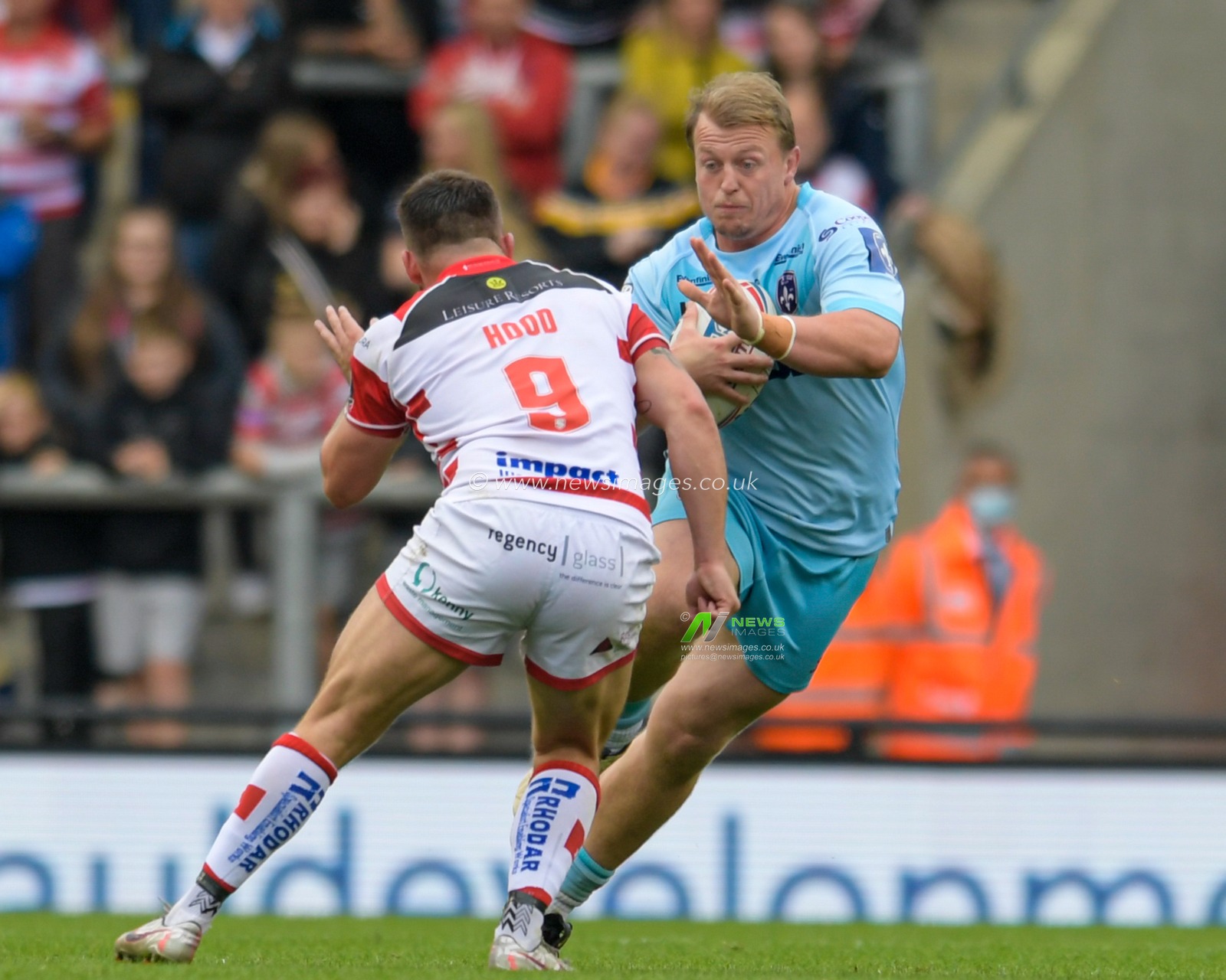 Eddie Battye (15) of Wakefield Trinity looks for a way past Liam Hood (9) of Leigh Centurions