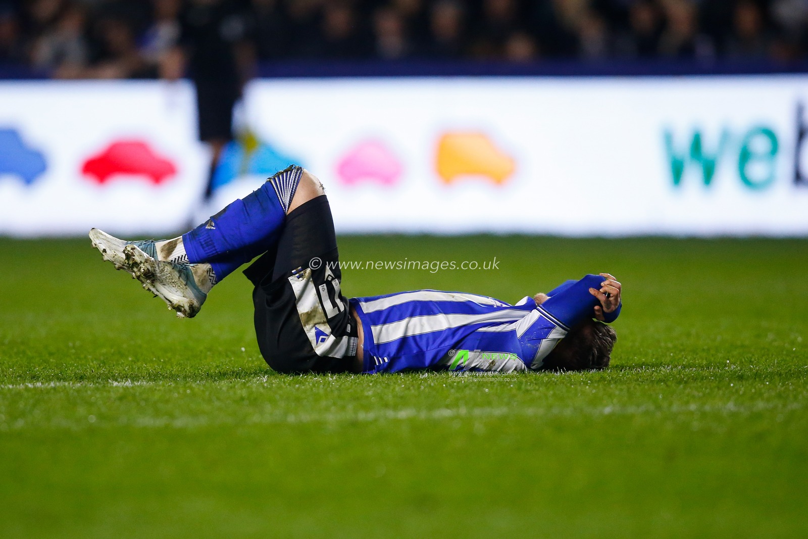 Josh Windass #11 of Sheffield Wednesday goes down with an injury during the Sky Bet League 1 match Sheffield Wednesday vs Bolton Wanderers at Hillsborough, Sheffield, United Kingdom, 17th March 2023

(Photo by Ben Early/News Images)