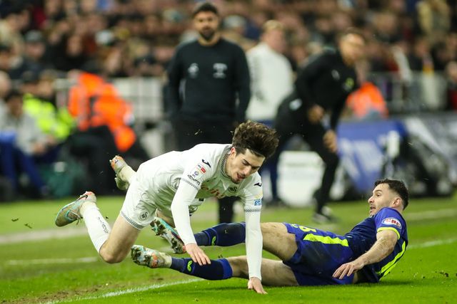 Josh Key of Swansea City is tackled by Andrew Hughes of Preston North End during the Sky Bet Championship match Swansea City vs Preston North End at Swansea.com Stadium, Swansea, United Kingdom on 24 February 2026

(Photo by Andrew Lewis/News Images)