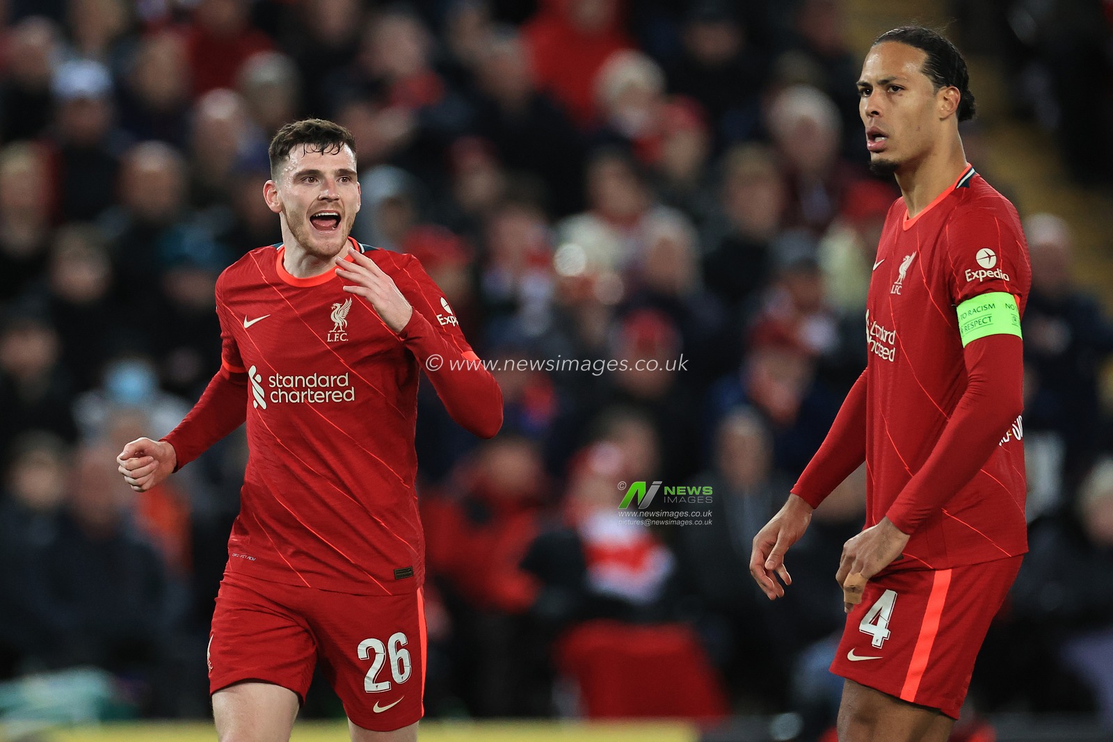 Andrew Robertson #26 of Liverpool speaks to Virgil van Dijk #4 of Liverpool