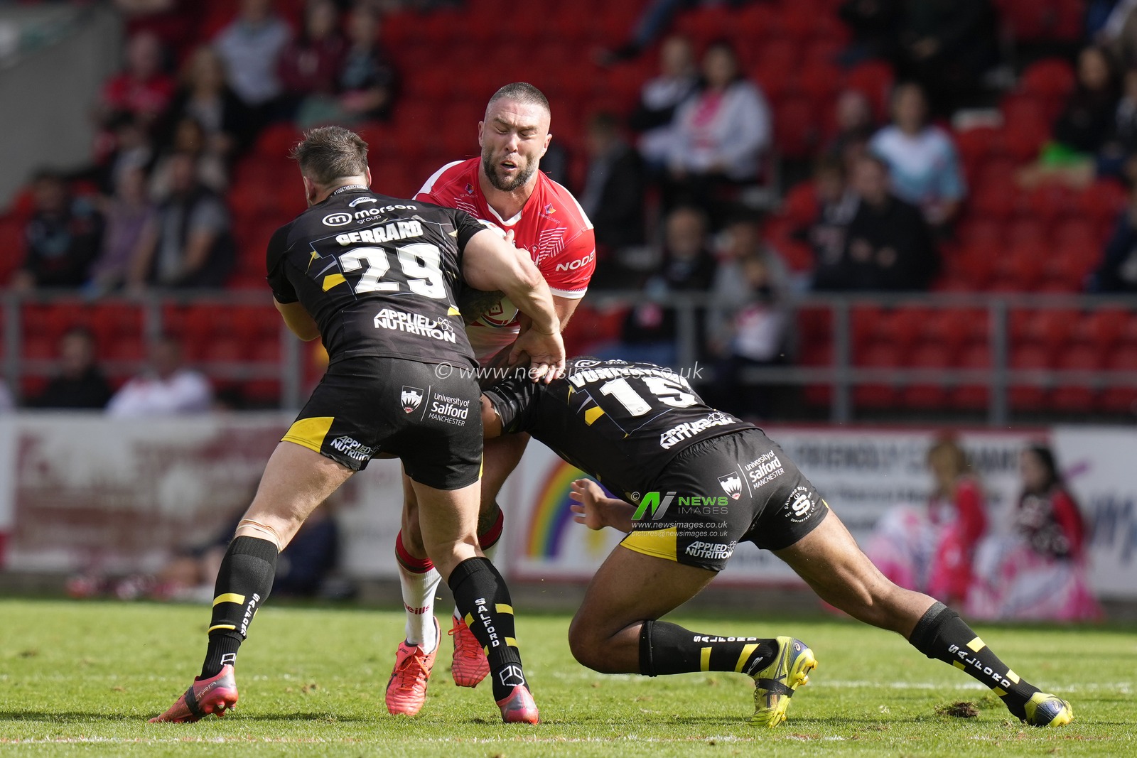 Alex Gerrard #29 and King Vuniyayawa #15 of Salford Red Devils tackle Curtis Sironen #16 of St Helens during the Betfred Super League match St Helens vs Salford Red Devils at Totally Wicked Stadium, St Helens, United Kingdom, 17th September 2022

(Photo by Steve Flynn/News Images)