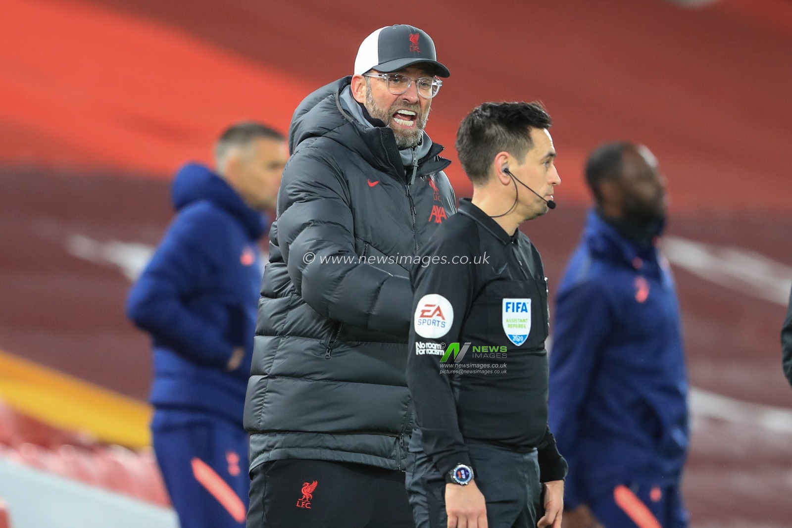 JÃ¼rgen Klopp manager of Liverpool reacts with an line official