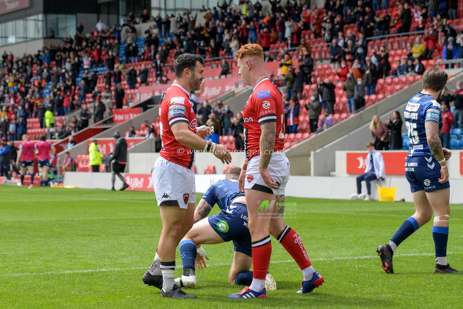 Harvey Livett (20) of Salford Red Devils celebrates scoring a try to make it 4-0