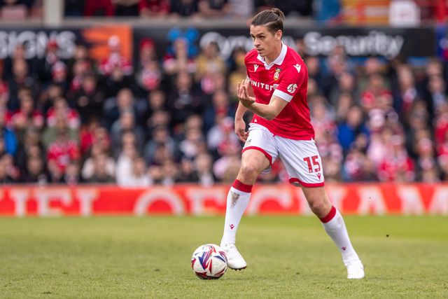 Wrexham's George Dobson carries the ball during the Sky Bet League 1 match Wrexham vs Stockport County at SToK Cae Ras, Wrexham, United Kingdom, 22nd March 2025

(Photo by Nik Mesney/News Images)