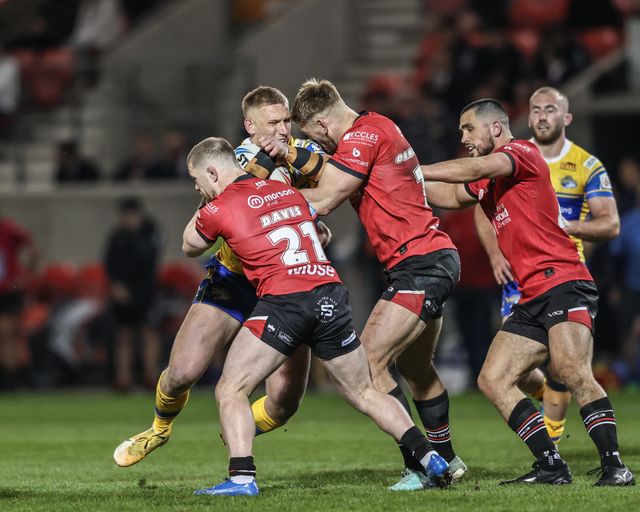 Mikolaj Oledzki of Leeds Rhinos is tackled by Jack Ormondroyd of Salford Red Devils during the Betfred Super League match Salford Red Devils vs Leeds Rhinos at Salford Community Stadium, Eccles, United Kingdom, 10th April 2025

(Photo by Alfie Cosgrove/News Images)