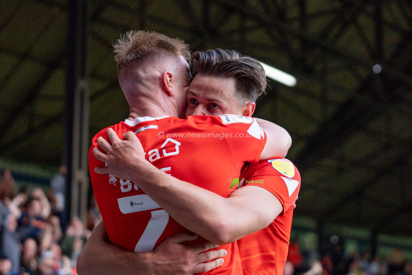 Harry Cornick #7 of Luton Town hugs James Bree #2 of Luton Town after the scoring the opening goal.