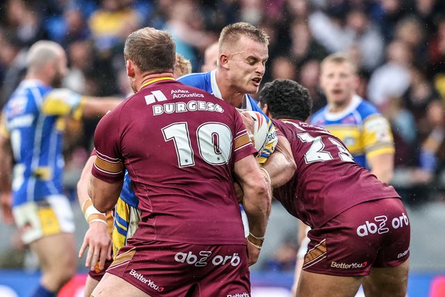 Cooper Jenkins of Leeds Rhinos is tackled by Tom Burgess of Huddersfield Giants and Taane Milne of Huddersfield Giants during the Betfred Super League Round 8 match Leeds Rhinos vs Huddersfield Giants at Headingley Stadium, Leeds, United Kingdom, 18th April 2025

(Photo by Alfie Cosgrove/News Images)