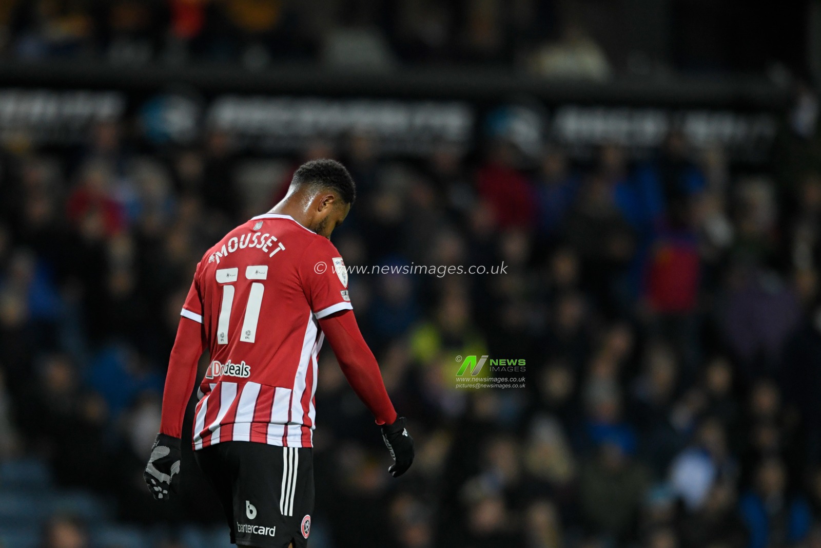 Lys Mousset #11 of Sheffield United looks down at the ground during the game