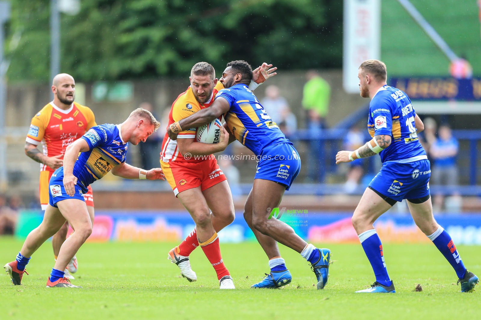 30th June 2019 , Emerald Headingley Stadium, England; Betfred Super League, Round 20, Leeds Rhinos vs Catalans Dragons ; Mickael Simon (15) of Catalans Dragons is tackled by Wellington Albert (36) of Leeds Rhinos 


Credit: Mark Cosgrove/News Images